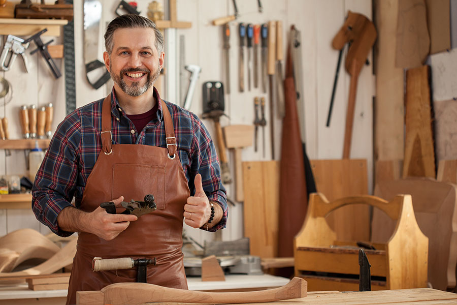 Business Insurance - Portrait Of Happy Carpenter