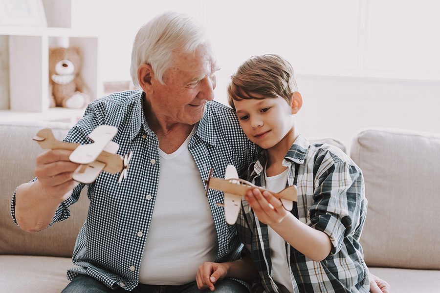 Employee Benefits - Grandpa Playing With Grandson